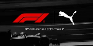Les logos de la Formule 1 et de Puma, avec la mention "Official Licensee of Formula 1®", sur un fond flou de voiture de course.